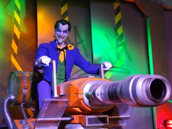 Fighting the Joker on Justice League: Battle for Metropolis, the interactive dark rides at multiple Six Flags parks.