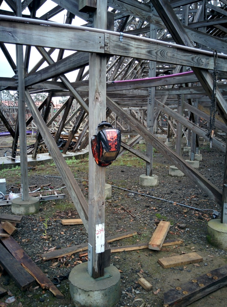 Hanging on the supports near the drop. If you weld roller coasters you get to have badass welding masks like this.
